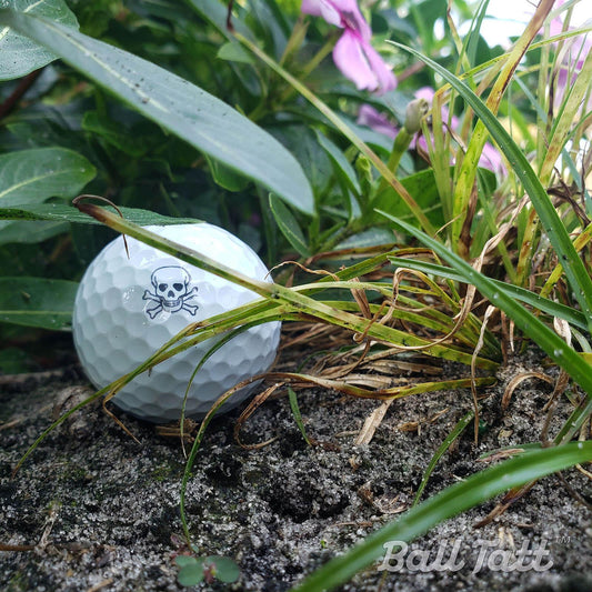 skull-crossbones-ball-tatt-flower-bed - GOLF LEAGUE
