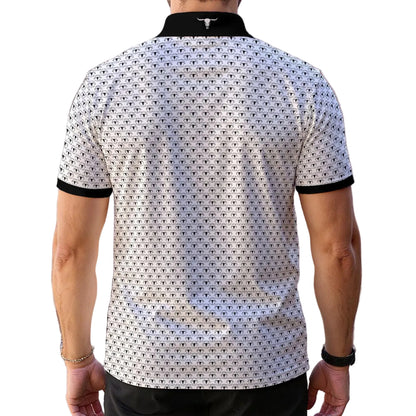 A man viewed from the back wearing a short-sleeve polo shirt with a black and white geometric pattern, black collar, and black sleeve cuffs, set against a soft pink wall background.